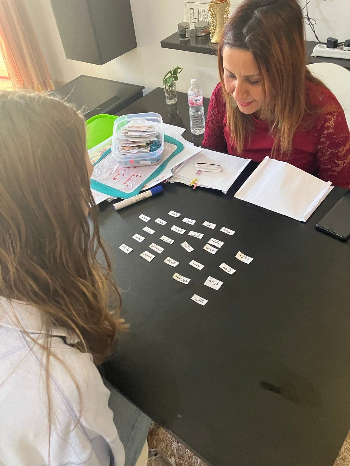 A student practicing Arabic vocabulary
